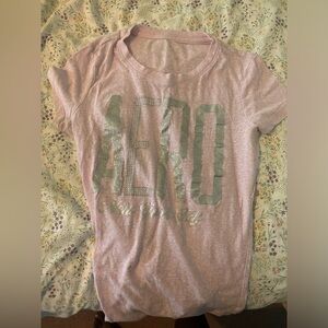 Pink shirt with silver words